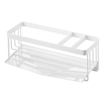 Suport alb pentru burete și sticlă cu scurgător lângă chiuvetă